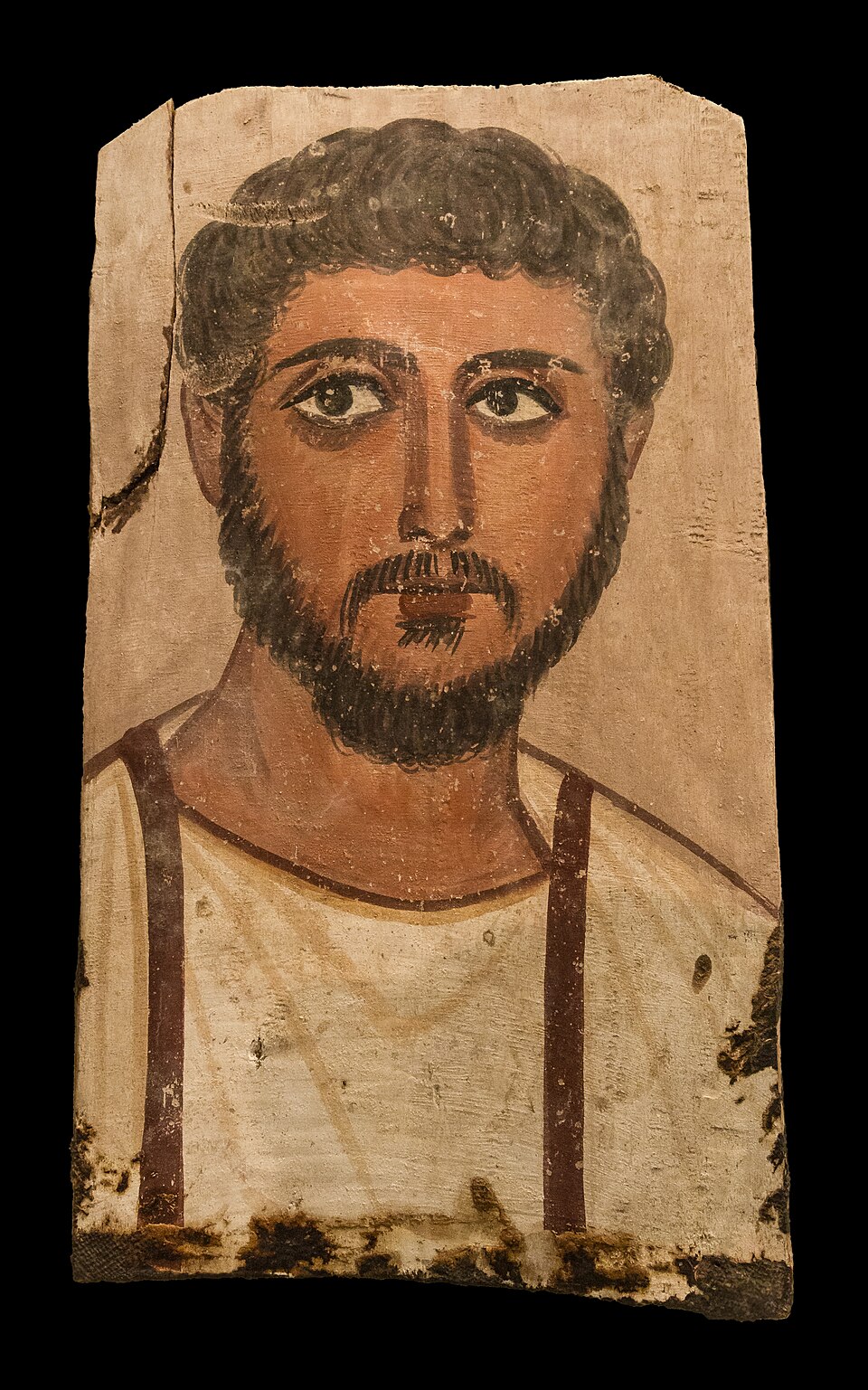 A borrowed ancient portrait reflected in tarnished glass